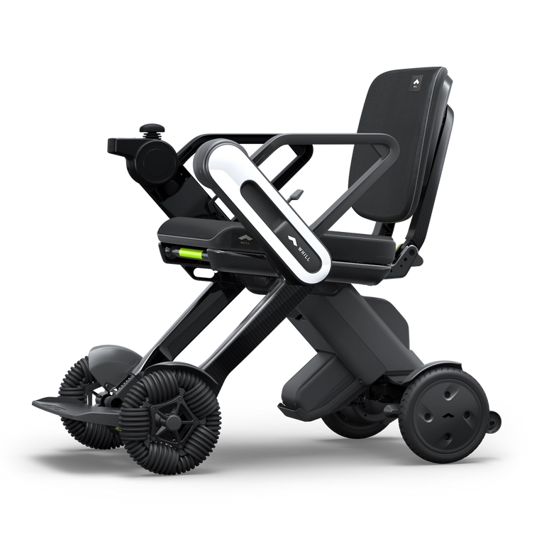 WHILL Model C Lite carbon power wheelchair with white arm covers, complete front three-quarter studio view