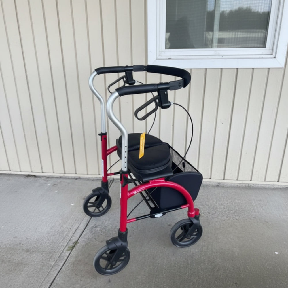 Angled indoor view of the red Evolution Xpresso Lite rollator showcasing its under-seat storage basket and sturdy frame.