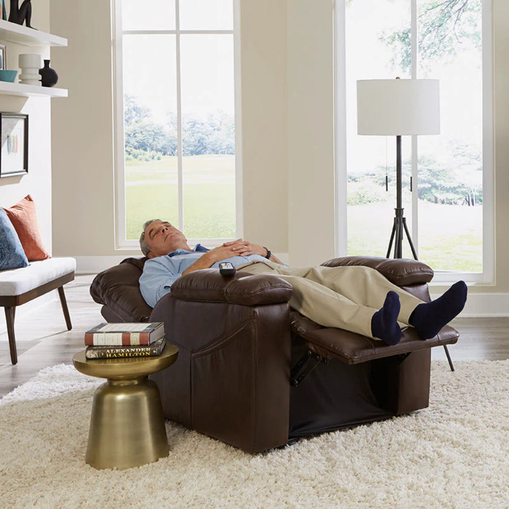 Lifestyle shot of a senior man relaxing comfortably in his living room while fully reclined in the Golden Rhea PL442 lift chair.
