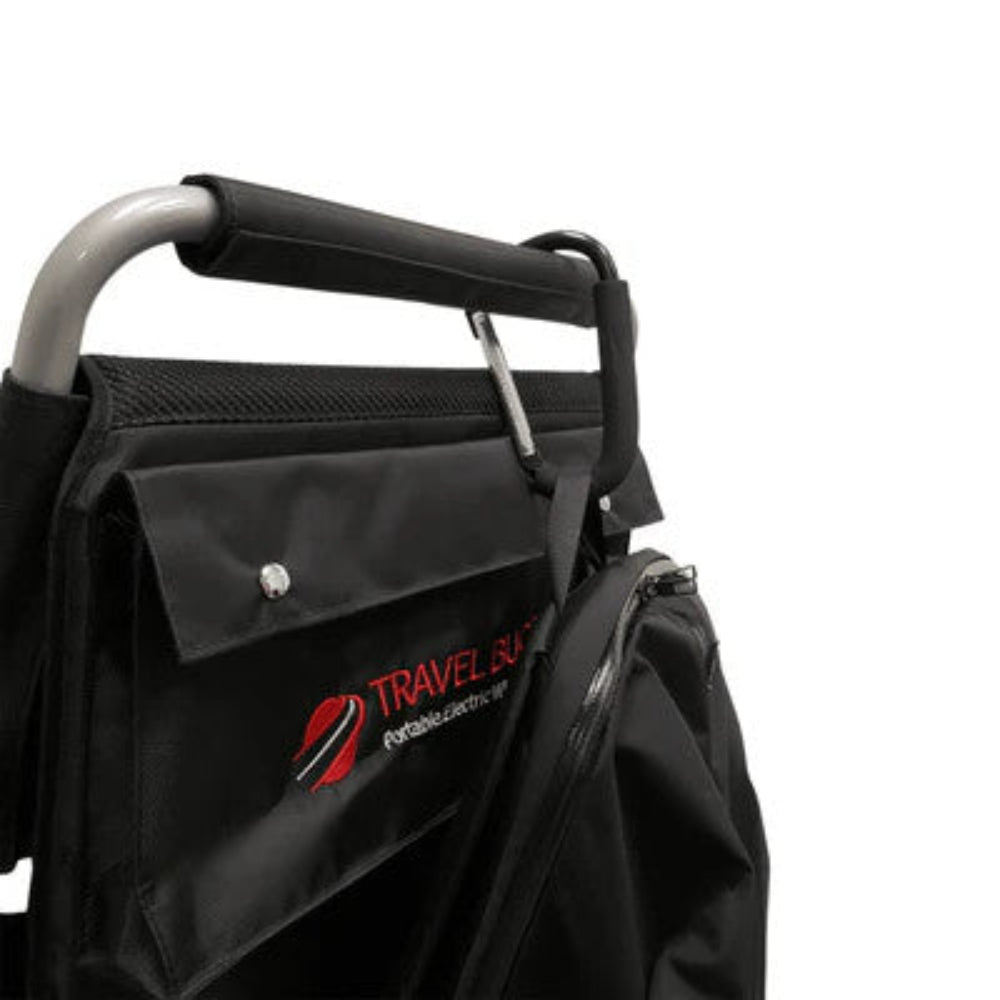 Travel Buggy aluminum bag hook securely attached to the center bar of a power wheelchair holding a day bag.