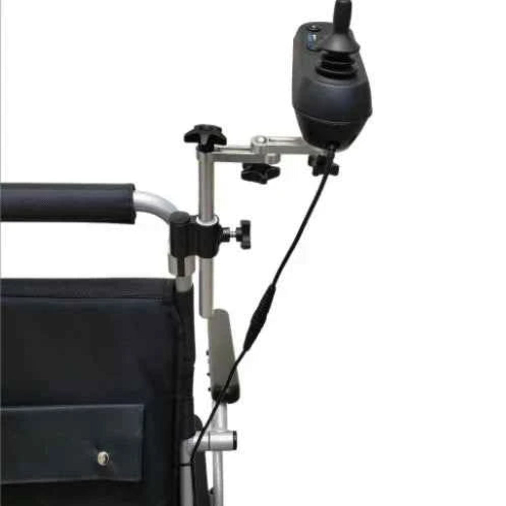Travel Buggy power wheelchair featuring the caregiver joystick mount installed on the rear backrest for easy collaborative control.