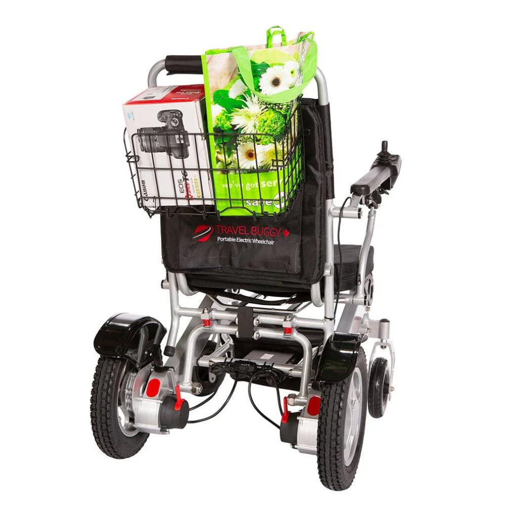 Rear view of a Travel Buggy power chair equipped with the detachable shopping basket loaded with daily groceries.