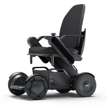 WHILL Model C2 High Back power wheelchair with black arm covers, studio view