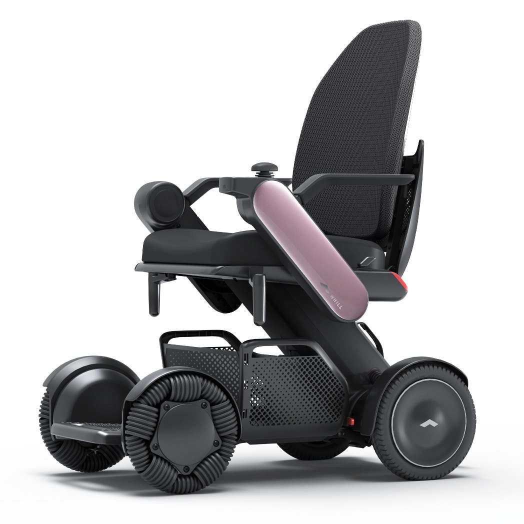 WHILL Model C2 High Back power wheelchair with pink arm covers, studio view