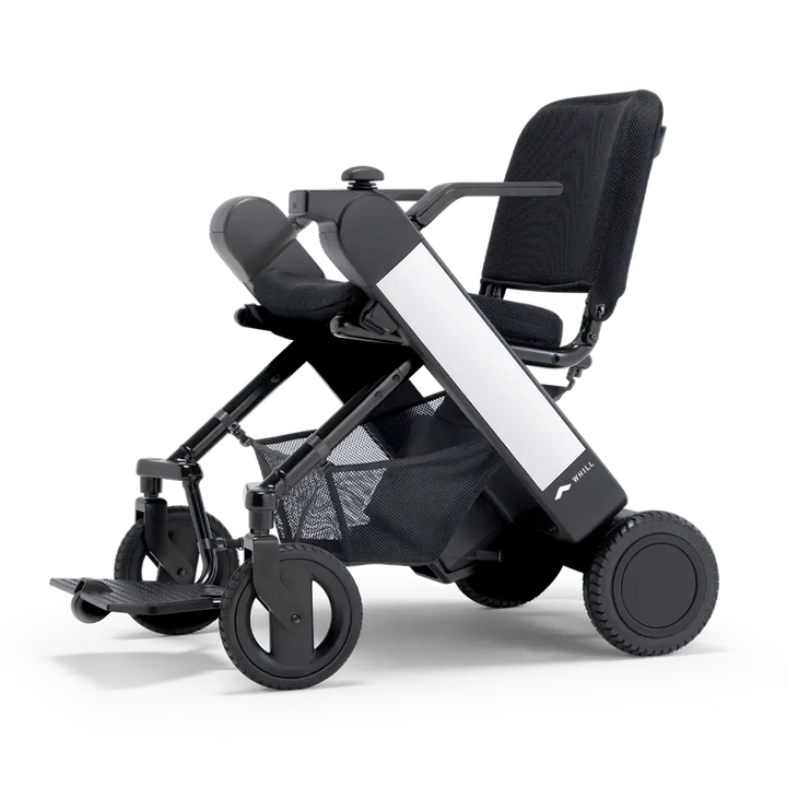 WHILL Model F folding power wheelchair, studio view
