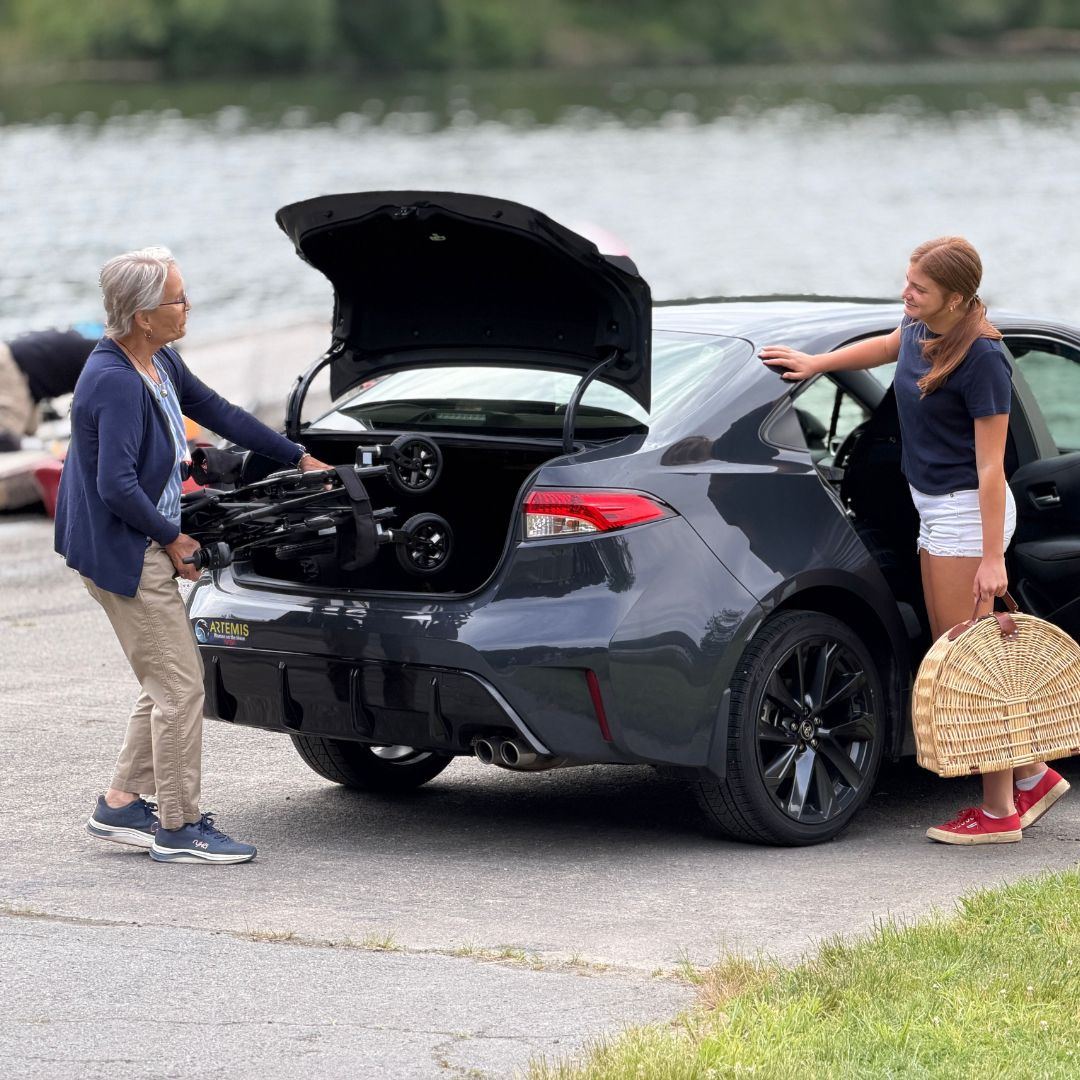 Golden Cricket LT GP309 folded and loaded into the trunk of a car