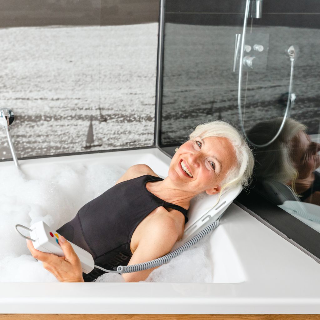 Drive Medical Bellavita Dive Bath Lift lowered deep into the tub