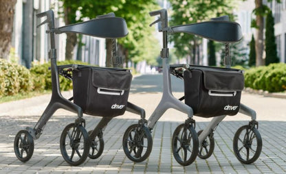 Drive Medical AeroCarbon Ultra-Lite Rollator in black and gray side by side on a city path
