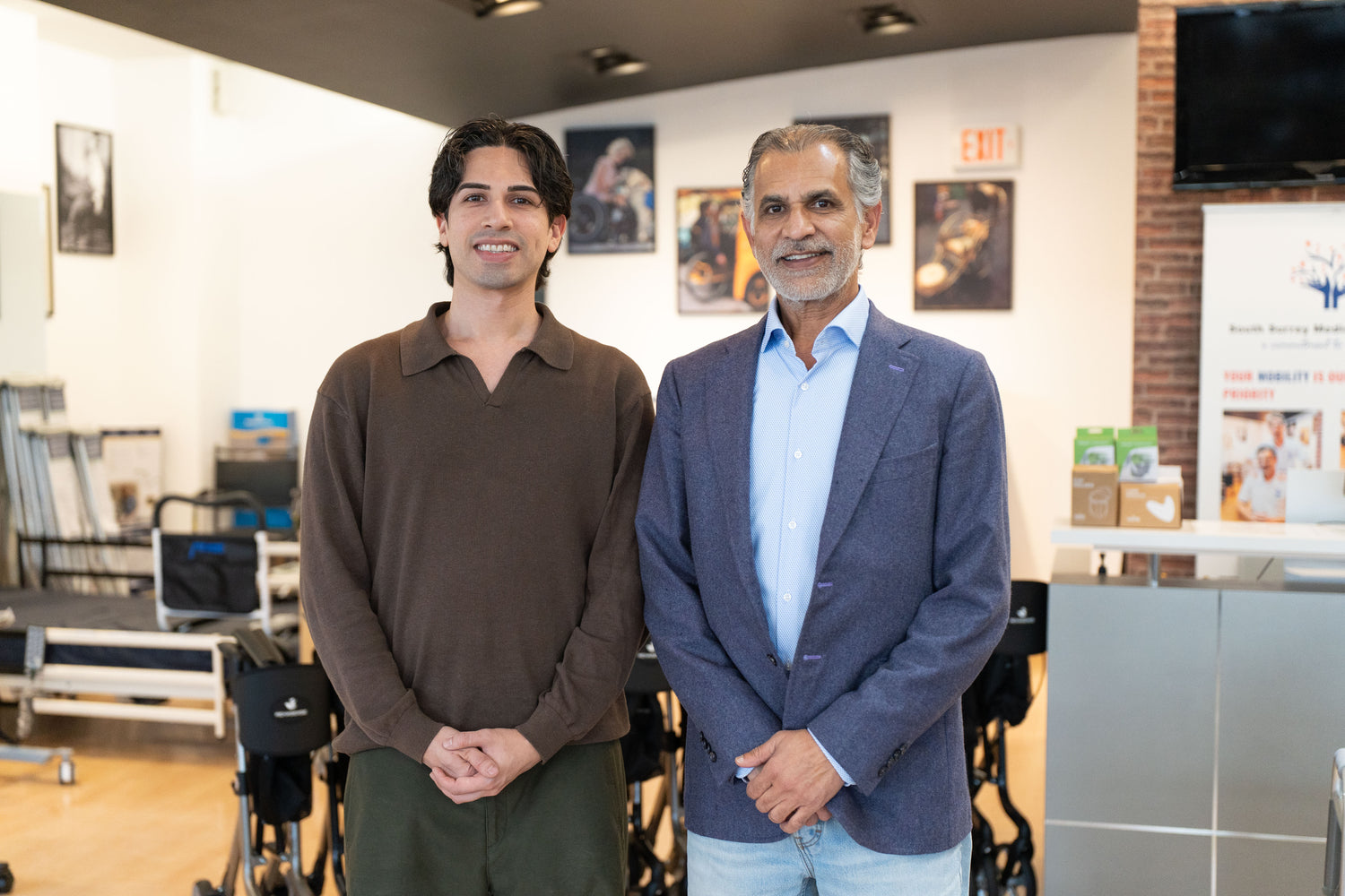 CareMade Canada owners, a father and son, standing together inside a medical equipment showroom