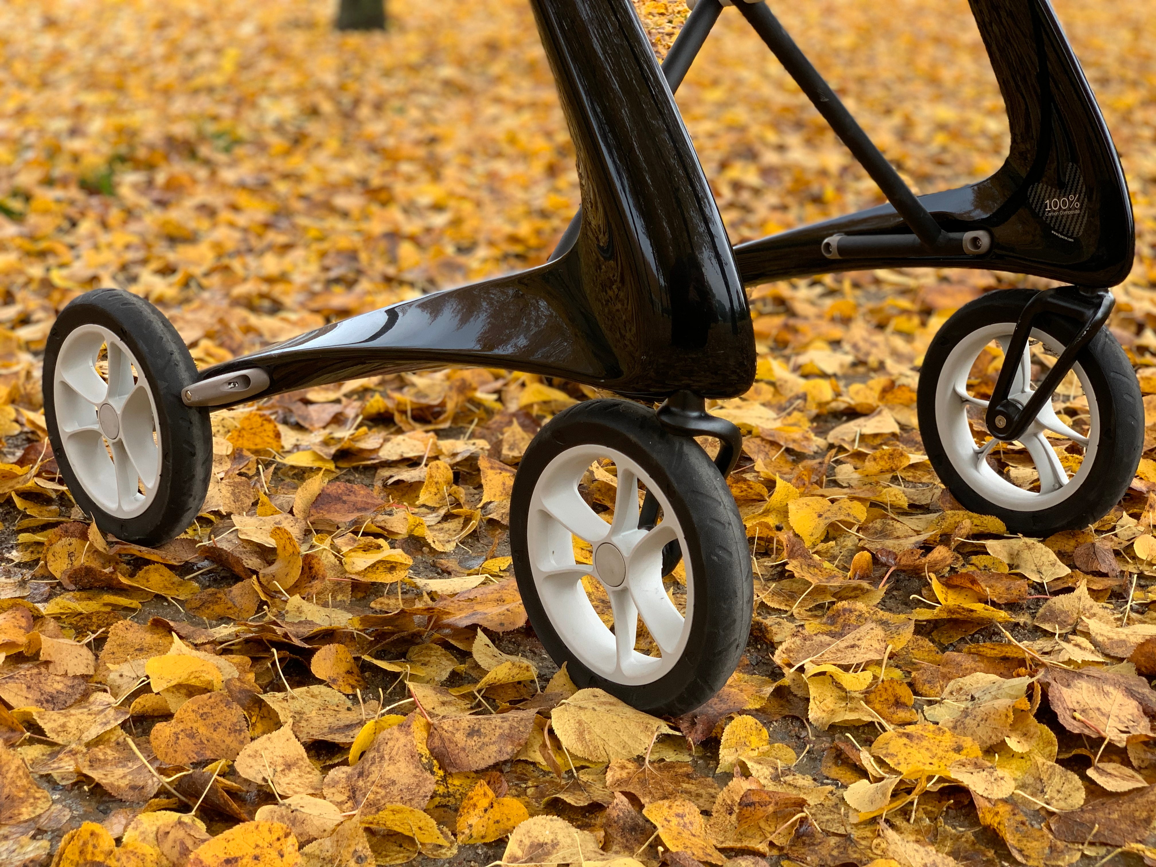 byACRE Carbon Ultralight wheels rolling over autumn leaves, showing the puncture proof tyres
