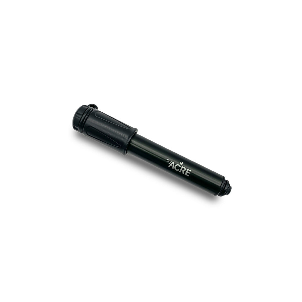 Standalone angled view of the compact black byACRE Mini Pump, a portable high-pressure maintenance tool designed for inflating Carbon Overland and Nordic Pioneer rollator tires.