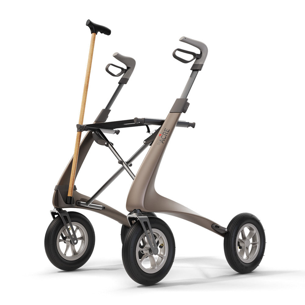 byACRE Carbon Overland Cane Holder mounted on brown rollator, front-left perspective