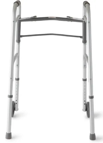 Rear view of the Care Made folding walker emphasizing the safe, non-slip rear glide caps and supportive cross-brace.