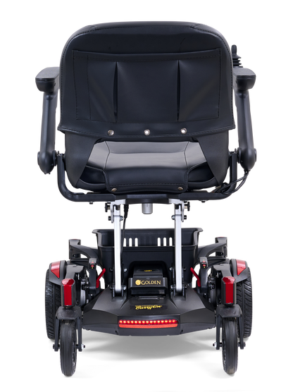Golden Buzzaround CarryOn GP130 power chair with red shrouds, rear view