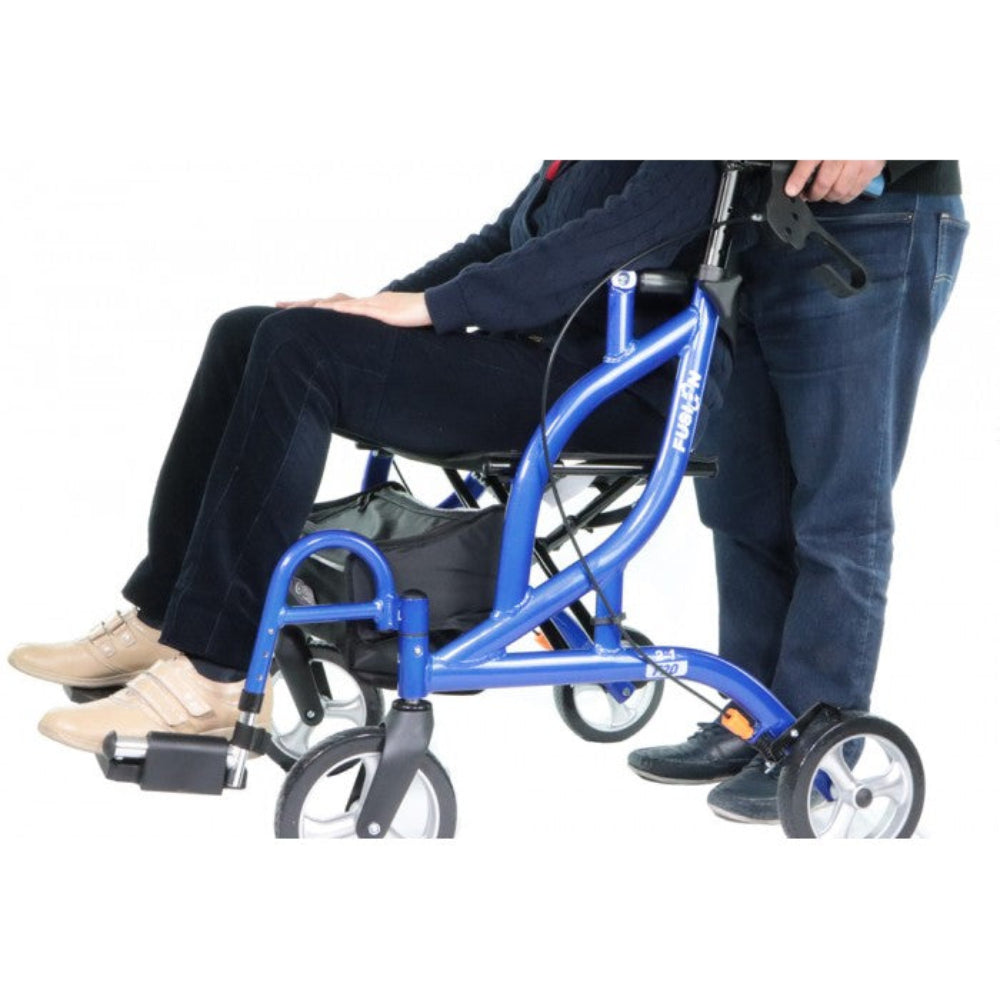 Lifestyle shot of a caregiver comfortably pushing a woman seated in the blue Airgo Fusion F20 transport chair.