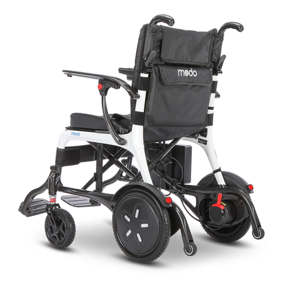 WHILL MODO Breeze carbon-fibre folding power wheelchair, complete rear three-quarter studio view