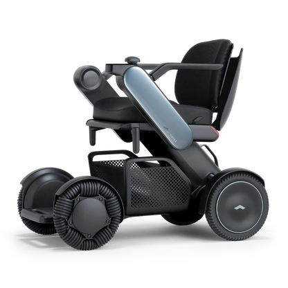 WHILL Model C2 power wheelchair with blue arm covers, front three-quarter studio view