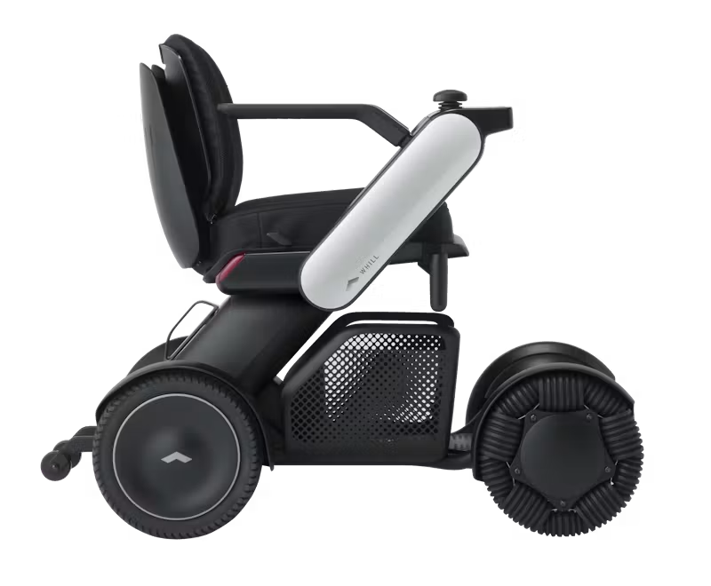 WHILL Model C2 power wheelchair with white arm covers, complete side studio view
