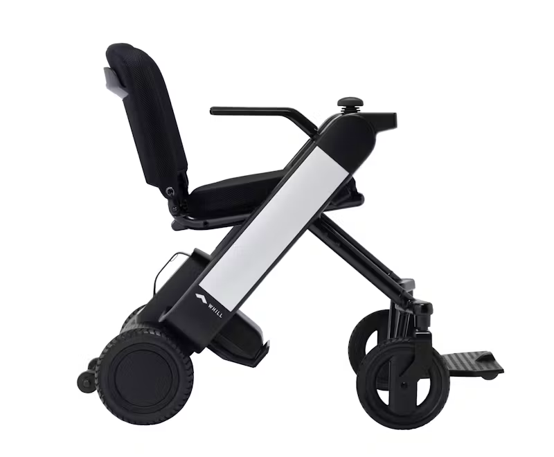 WHILL Model F power wheelchair with white arm covers, complete side studio view