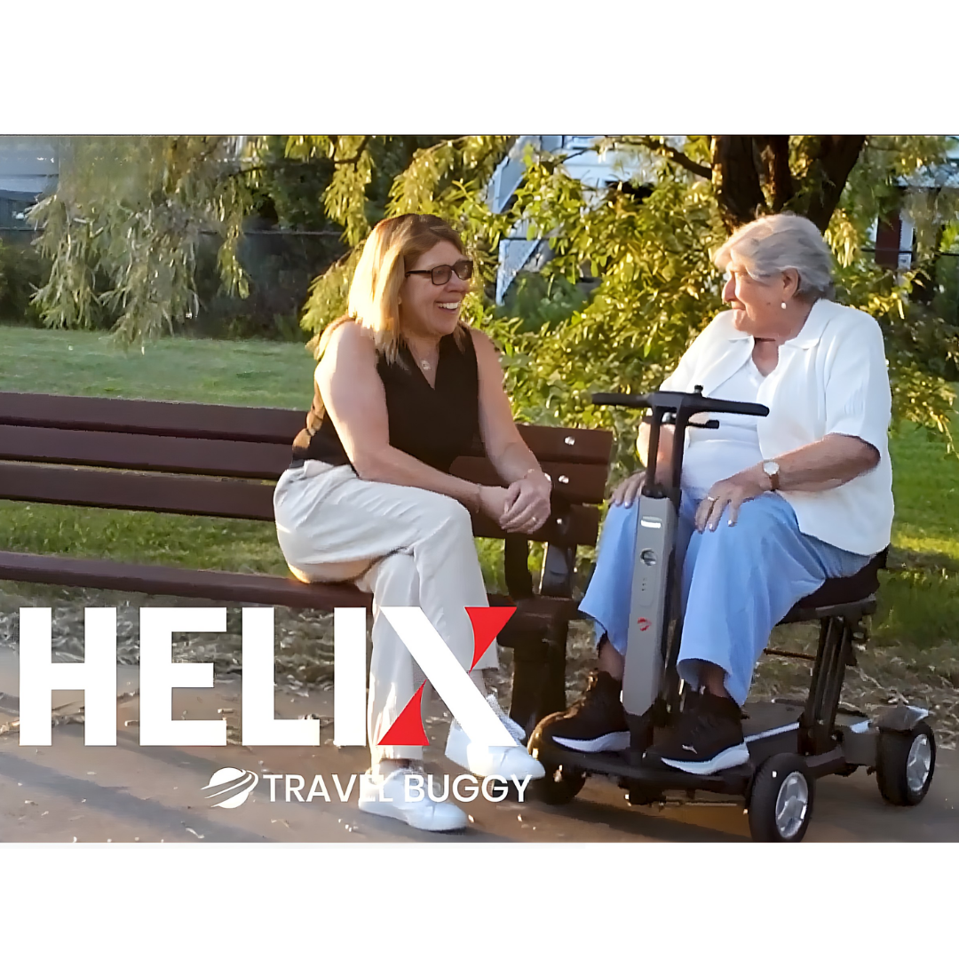 Lifestyle image of a couple relaxing outdoors, with the man comfortably seated on the Travel Buggy HELIX scooter.