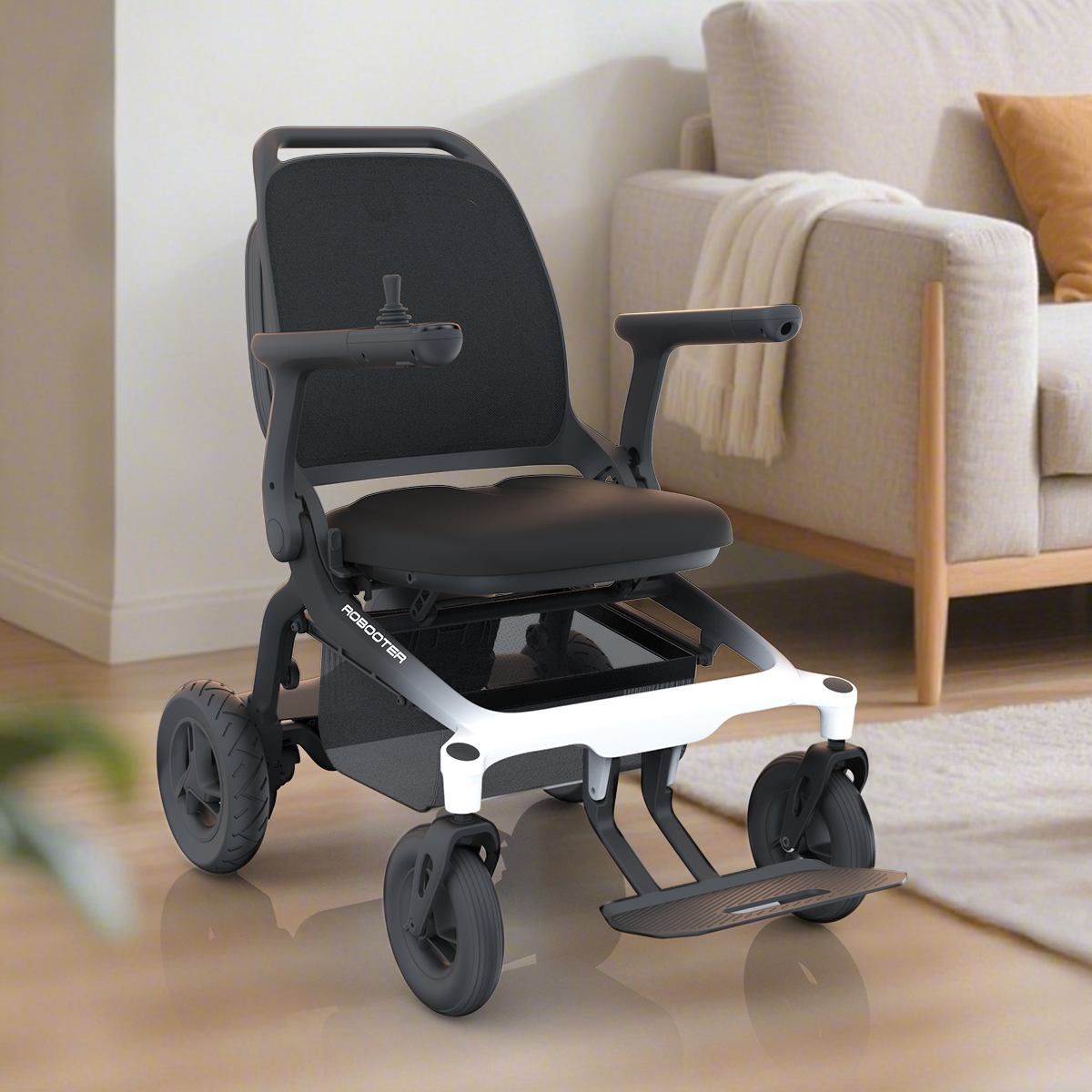 Robooter E80 carbon fibre power wheelchair beside a sofa