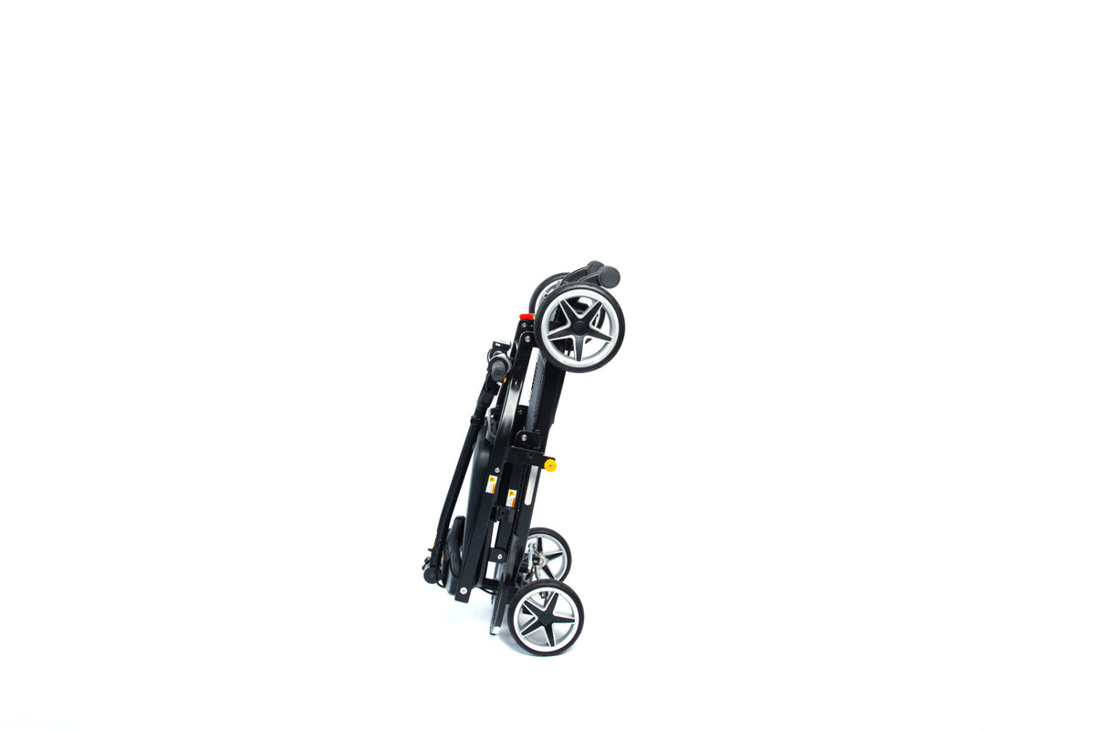 eFOLDi Compass folded and standing upright on its transport wheels