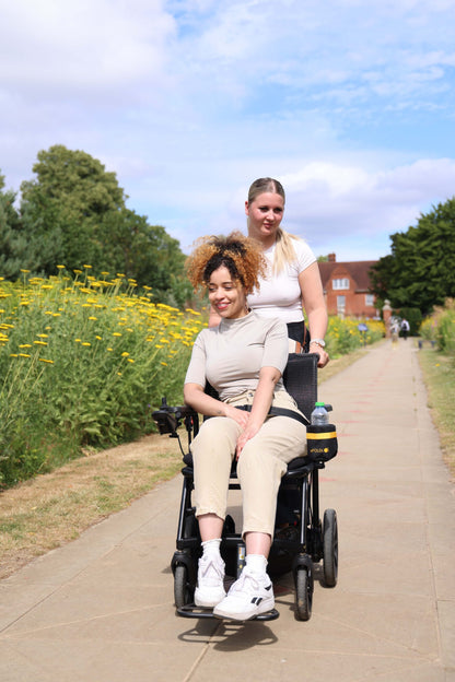 eFOLDi Navigator on a smooth paved path with attendant assistance