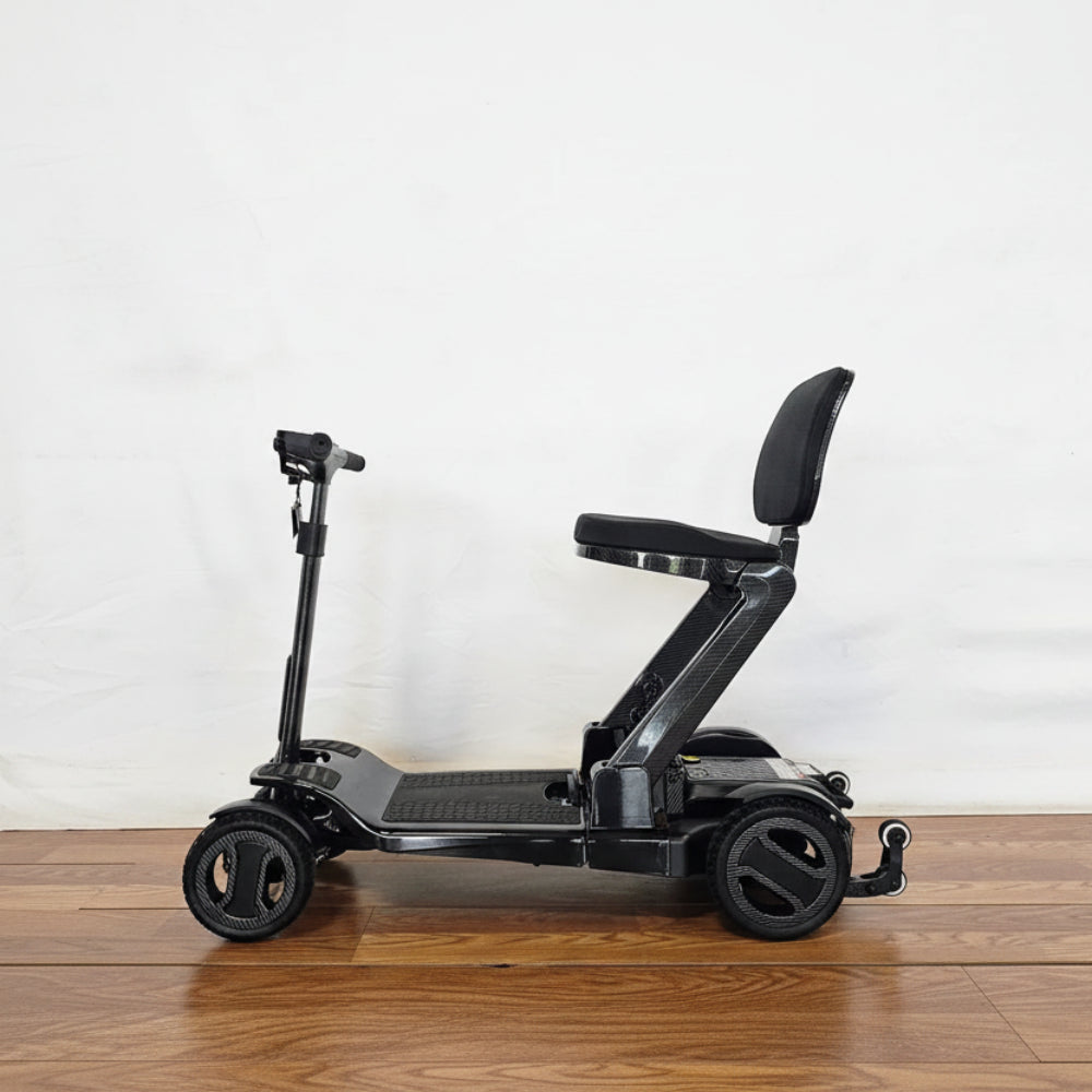 Go Go Carbon fiber mobility scooter designed for tight turning radiuses and easy indoor maneuverability.