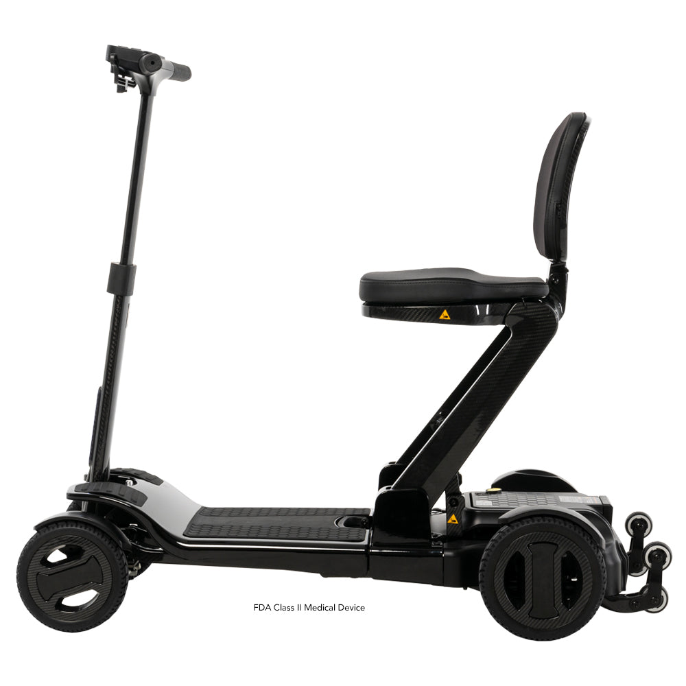 Side profile of the Go Go Carbon travel scooter highlighting its sleek carbon fiber frame and seating.