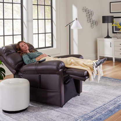 Woman asleep under a blanket in a fully reclined Golden Cloud PR510 lift chair