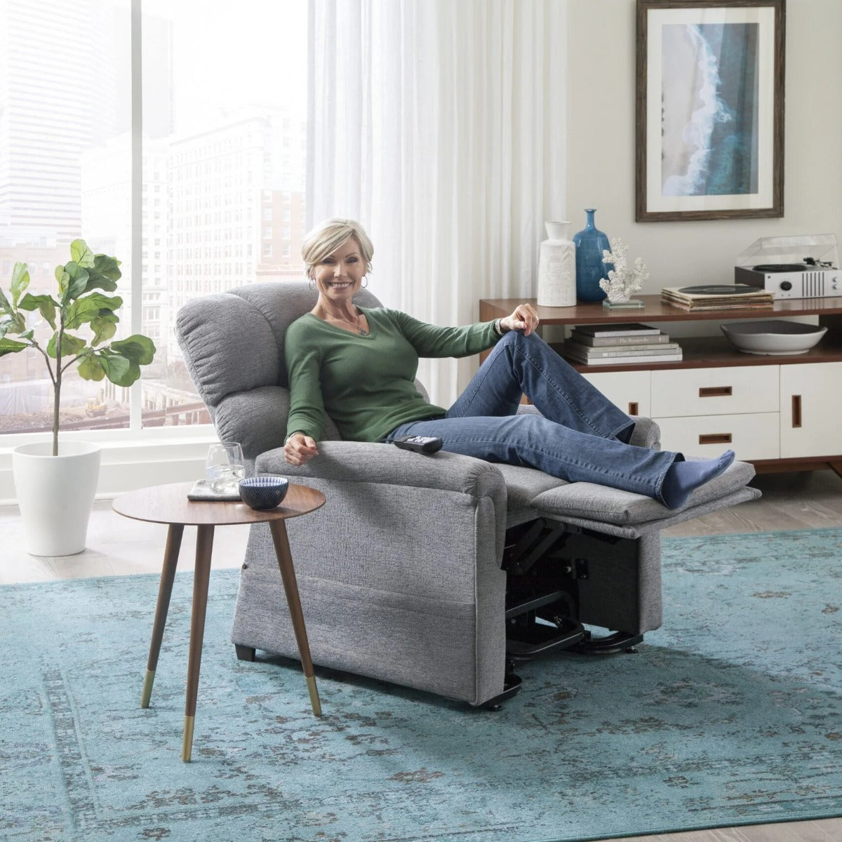 Woman relaxing in the TV position of her Golden MaxiComforter PR535 lift chair at home