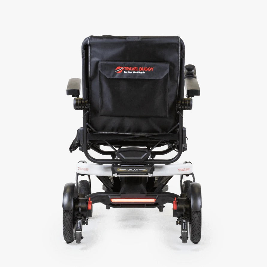 Rear view of the Travel Buggy Grand Tourer GT power wheelchair showing the wide footplate.