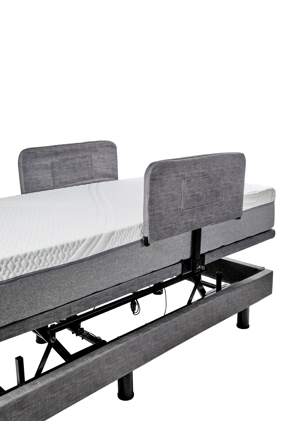 Grey padded Harmony Hi-Low side rail covers fitted over the bed rails, matching the base upholstery