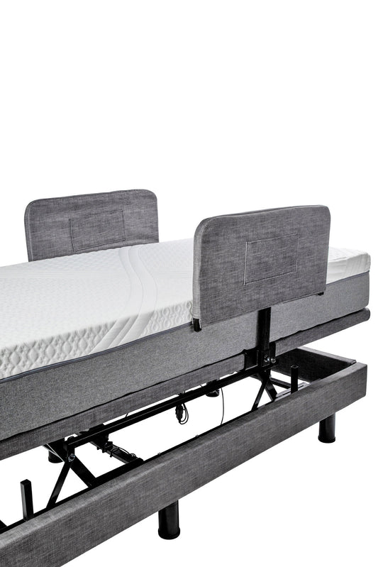 Grey padded Harmony Hi-Low side rail covers fitted over the bed rails, matching the base upholstery