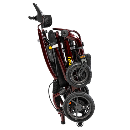 Pride Jazzy Carbon 27 power wheelchair in Black Cherry, folded for transport