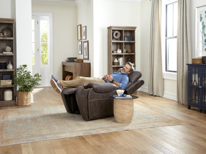 Lifestyle shot of a man relaxing comfortably in his living room while seated in the Golden Titan PL449 lift chair.