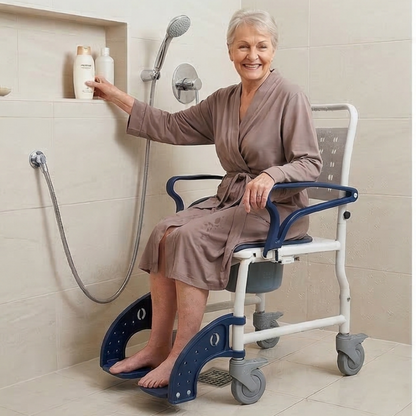 Lifestyle shot of a man comfortably seated in the MOBB 3-in-1 shower commode wheelchair being used as a transport chair indoors.