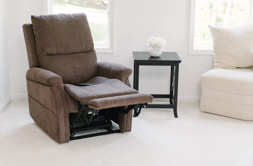 Pride VivaLift! Metro 2 lift chair in Saville Brown, reclined with the footrest raised in a living room