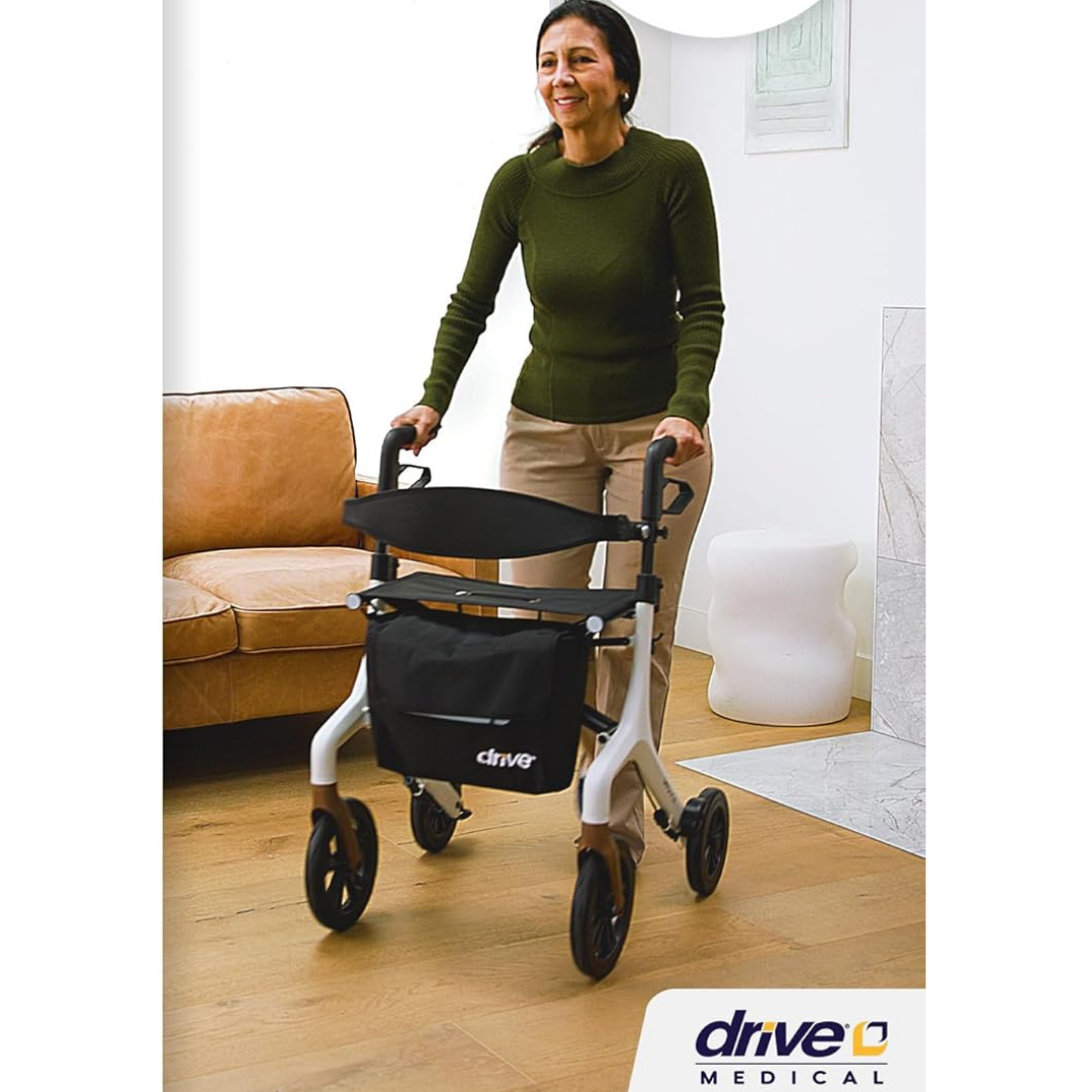 Lifestyle image of a man smoothly navigating his home living room with the highly maneuverable AeroWalk ultra-lite rollator.