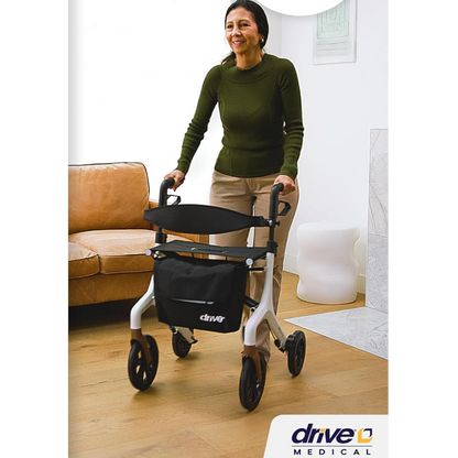 Lifestyle image of a man smoothly navigating his home living room with the highly maneuverable AeroWalk ultra-lite rollator.