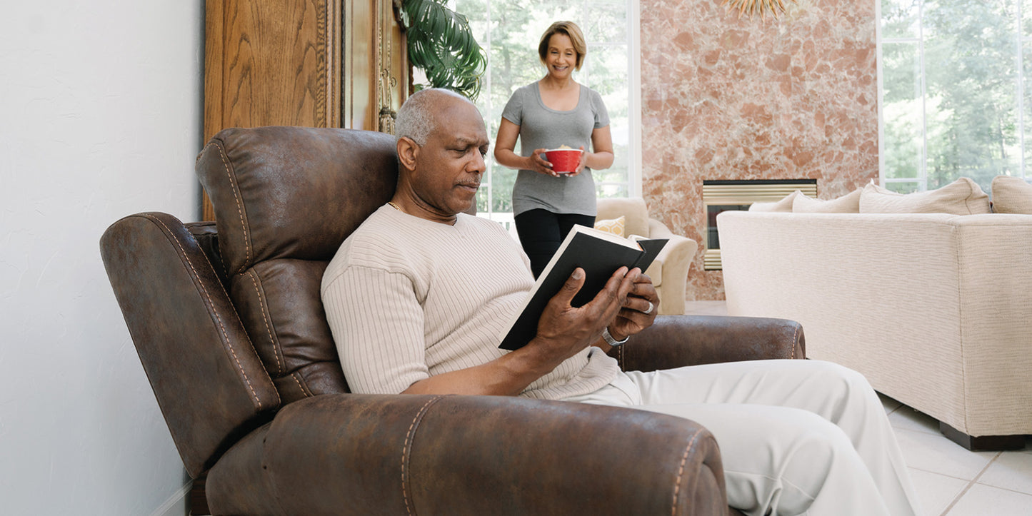 Reading at home in a Pride VivaLift Tranquil 2 PLR-935 lift chair in Astro Brown