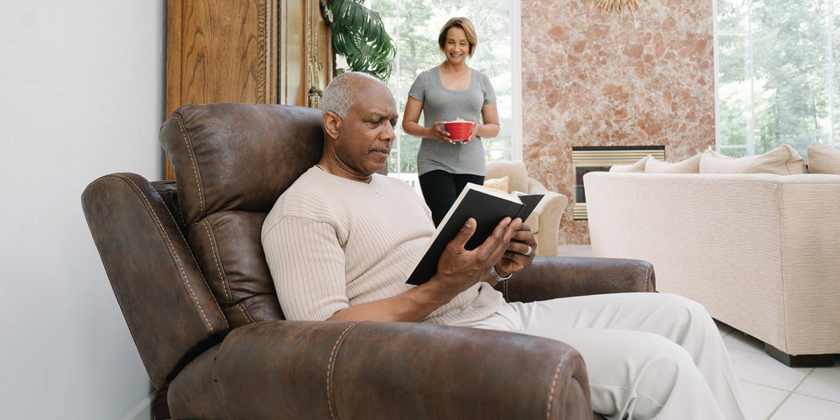 Reading at home in a Pride VivaLift Tranquil 2 PLR-935 lift chair in Astro Brown