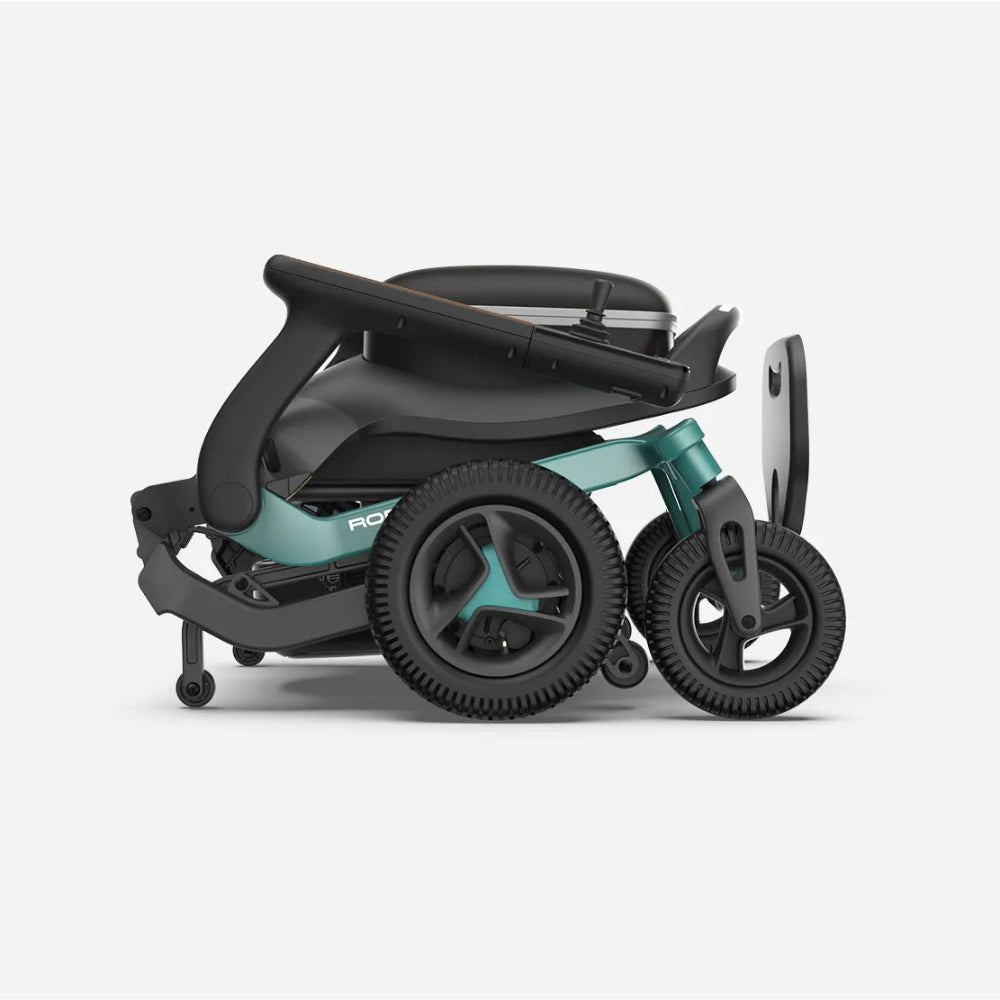 Teal Robooter E40 power wheelchair folded flat for easy trunk storage and travel