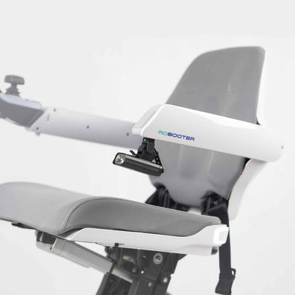 Side profile image showing the LED handrail lamp securely mounted to the armrest of the white Robooter X40 wheelchair for enhanced low-light safety.