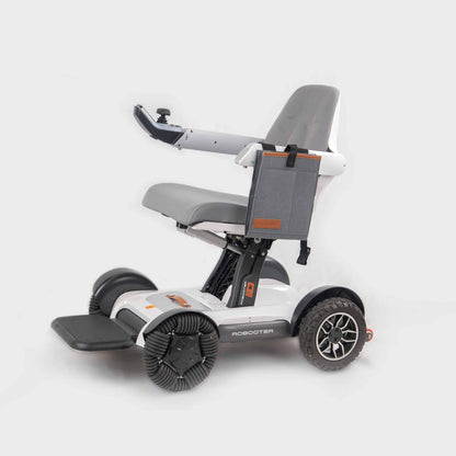 Side profile view of the sleek grey Robooter X40 electric wheelchair featuring the specialized side armrest bag securely mounted for low-profile storage.
