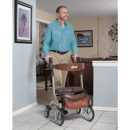 Senior man enjoying smooth indoor mobility with the stylish champagne Drive Medical Nitro DLX rollator.