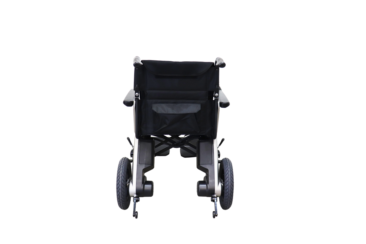 Signature Series Out & About power wheelchair, rear view showing push handles, backrest pocket and twin battery housings