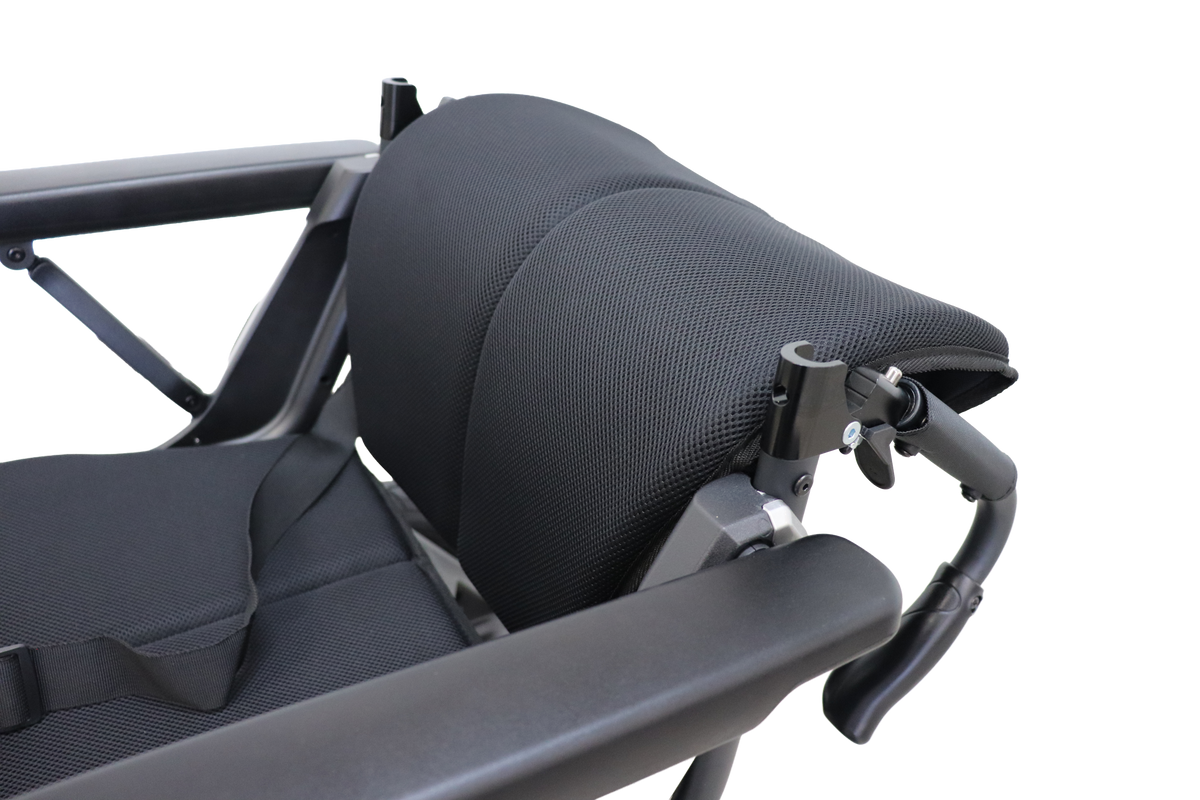 Signature Series Out & About power wheelchair, close-up of black seat, backrest, belt and folding backrest hinges