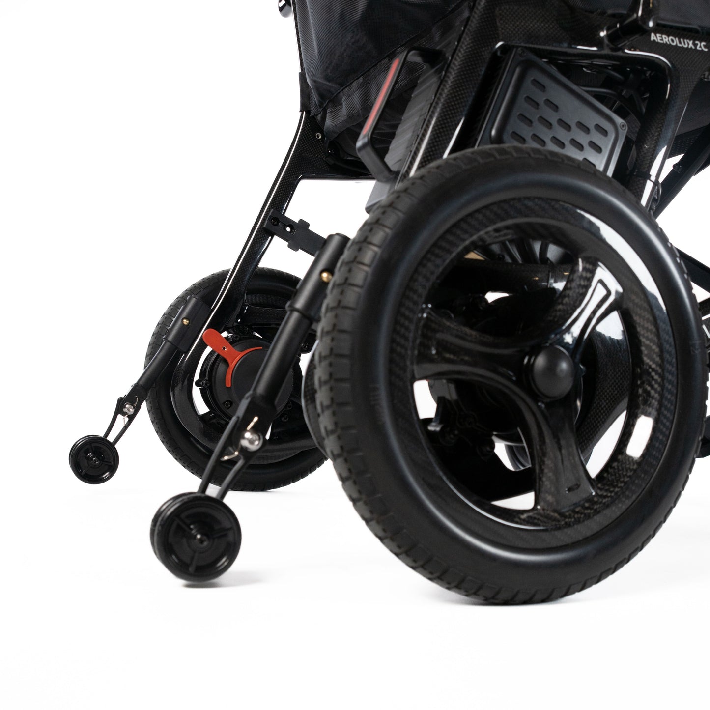 Travel Buggy AEROLUX 2C rear wheel and anti-tip wheel close-up on a white background