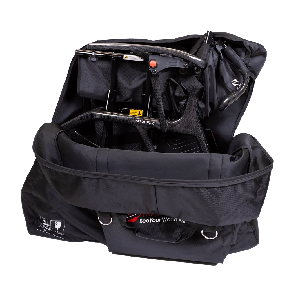 Travel Buggy AEROLUX 2C carbon fiber power wheelchair folded securely inside the custom fitted travel bag.